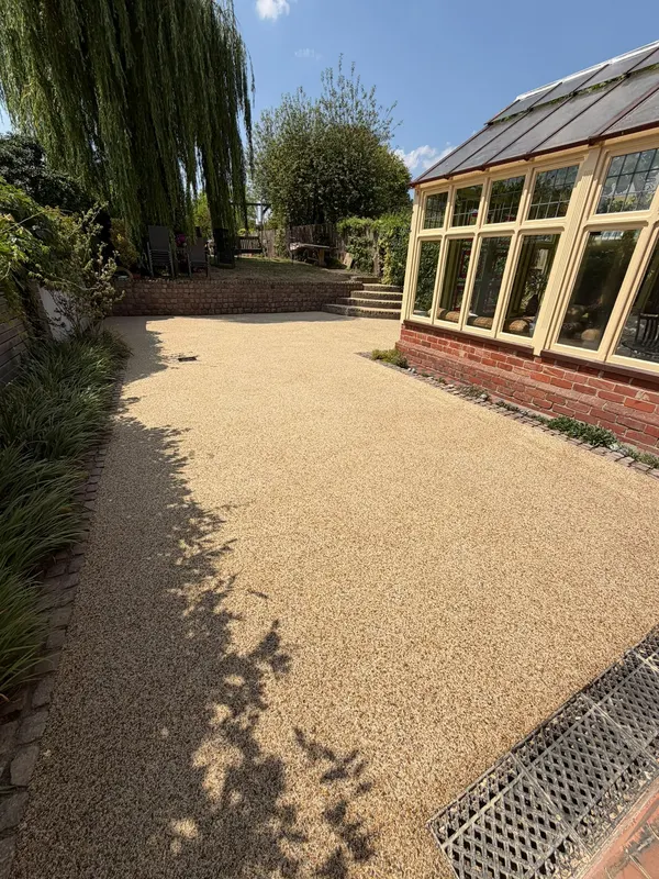 Golden resin path beside a conservatory
