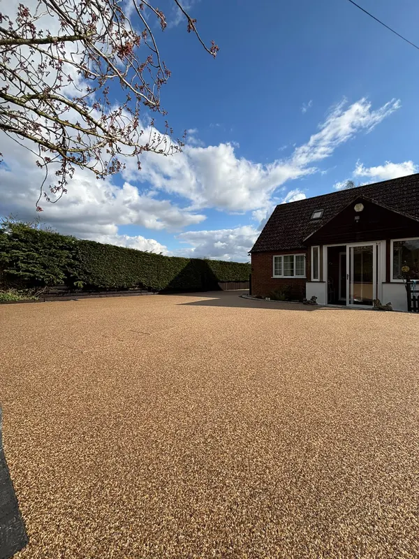 Wide golden resin bound driveway