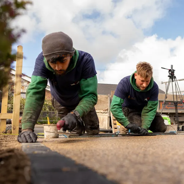 Two of the team detailing a border